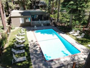 an overhead view of a swimming pool with chairs and a house at Pinenut Place home in Incline Village
