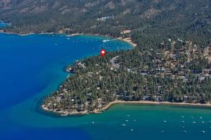 a red balloon flying over a small island in the water at Zephyr Cabin home in Zephyr Cove