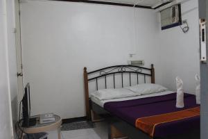 Postel nebo postele na pokoji v ubytování St Nicolas Inn CDO City Center