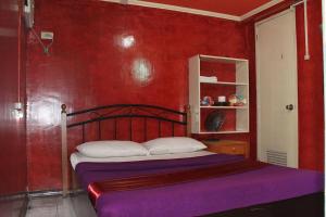 Postel nebo postele na pokoji v ubytování St Nicolas Inn CDO City Center