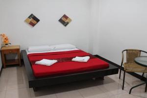 Postel nebo postele na pokoji v ubytování St Nicolas Inn CDO City Center
