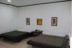 Postel nebo postele na pokoji v ubytování St Nicolas Inn CDO City Center