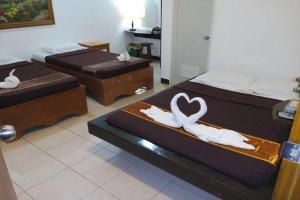 Postel nebo postele na pokoji v ubytování St Nicolas Inn CDO City Center