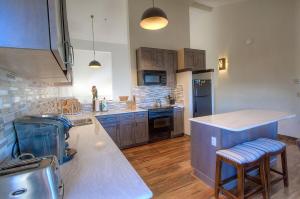 a large kitchen with a counter and a counter top at Lakescape condo in Stateline
