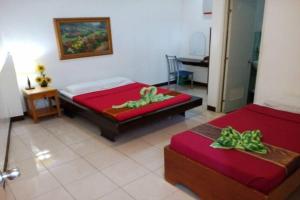 Postel nebo postele na pokoji v ubytování St Nicolas Inn CDO City Center