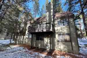 a house with two balconies on it in the snow at Brookstone Pines home in Incline Village