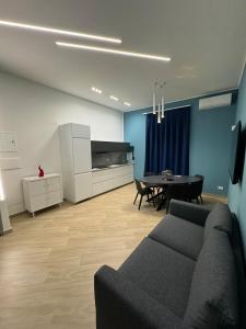 a living room with a couch and a table at Matera's Flats By Dimorra in Naples