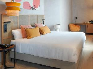 Postel nebo postele na pokoji v ubytování Tradere Hotel Boutique