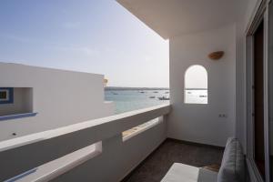 a white room with a view of the water at Formentera Especial in La Savina