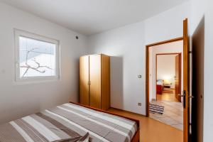 Postel nebo postele na pokoji v ubytování Apartments Hasnek + 57 fotografií