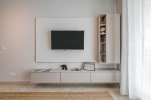 Televízia a/alebo spoločenská miestnosť v ubytovaní Apartment Stiv Luxe