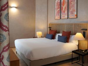 Postel nebo postele na pokoji v ubytování Tradere Hotel Boutique