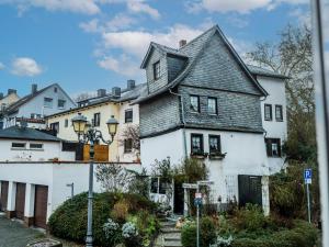 a white house with a gray roof at Wetzlarer Hof Hotel & Restaurant in Wetzlar