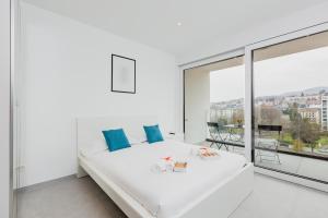 Letto o letti in una camera di Campus Lugano 45 wonderful Smart Suites in the university area