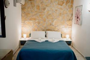 Postel nebo postele na pokoji v ubytování Villa Palma