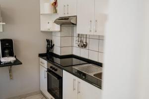 Kuchyň nebo kuchyňský kout v ubytování Villa Palma