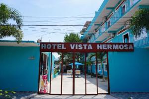 a hotel vista hermososa sign on a street at Hotel Vista Hermosa Aeropuerto Puerto Vallarta in Puerto Vallarta