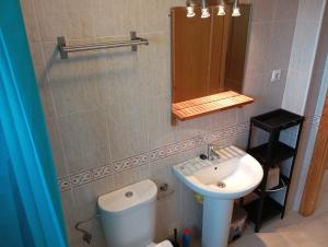 a bathroom with a sink and a toilet and a mirror at C Veneziola A 2J Admer in San Blas +9 photos