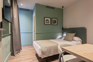 Postel nebo postele na pokoji v ubytování Hotel Via Augusta