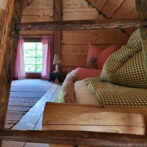 Postel nebo postele na pokoji v ubytování Sachserhof Ferienwohnungen in Sachsenburg