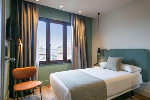 Postel nebo postele na pokoji v ubytování Hotel Via Augusta