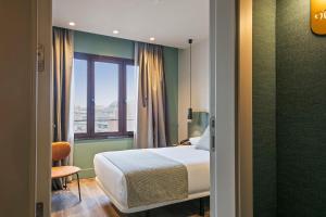 Postel nebo postele na pokoji v ubytování Hotel Via Augusta