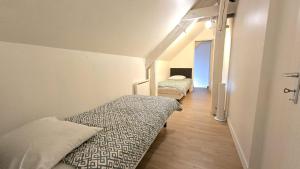 Giường trong phòng chung tại Le Voyageur A la plage vue mer