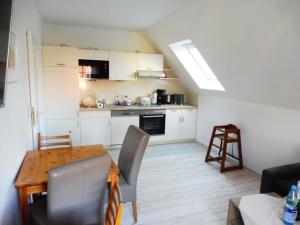 Η κουζίνα ή μικρή κουζίνα στο Apartments Bensersiel