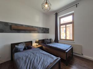 Katil atau katil-katil dalam bilik di Mikra Homes24 in Gößnitz