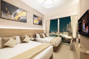 Μια τηλεόραση ή/και κέντρο ψυχαγωγίας στο NEW Burj Khalifa and Fountains View Luxury Apt