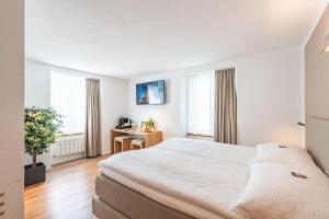Postel nebo postele na pokoji v ubytování Hotel Artist