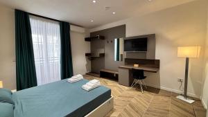 Ένα ή περισσότερα κρεβάτια σε δωμάτιο στο Seaside Suites