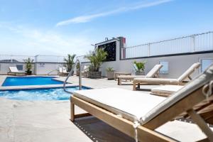 a patio with a swimming pool on a building at Cairns Central Apartment 1011 in Cairns