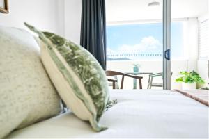 Ένα ή περισσότερα κρεβάτια σε δωμάτιο στο Cairns Central Studio 1012