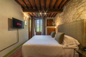 TV a/nebo společenská místnost v ubytování Ultimo Mulino Country Hotel