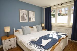 Postel nebo postele na pokoji v ubytování Ferienwohnung mit traumhaftem Meerblick - Haus am Meer FeWo 04