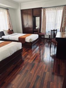 Voodi või voodid majutusasutuse Fuji Hotel toas
