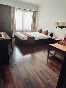Voodi või voodid majutusasutuse Fuji Hotel toas
