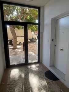 a room with a door open to a courtyard at guadiaro studio in Málaga