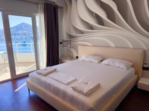 Postel nebo postele na pokoji v ubytování Airstay seaview Saranda