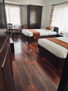 Voodi või voodid majutusasutuse Fuji Hotel toas