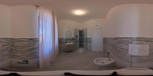 a bathroom with a shower and a toilet in it at La Stazione Sabina Alloggio Turistico in Stimigliano +66 photos