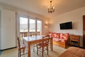 TV a/nebo společenská místnost v ubytování Lans en Vercors Studio 2 pièces