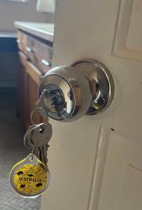 a lock on a door with a key at Single room 10 minutes to Central London in London