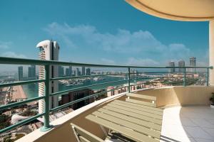 a balcony with a view of a city at Prime Location - 2BR with Spectacular Sea View in Dubai