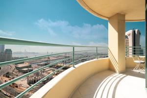 a balcony with a view of a city at Prime Location - 2BR with Spectacular Sea View in Dubai