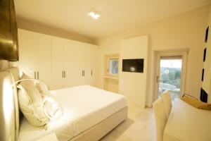 TV a/nebo společenská místnost v ubytování Villa Leonardo Luxury Locorotondo