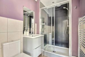 a bathroom with a shower and a sink at Thistle Apartment Golspie in Golspie +10 photos