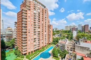 an overhead view of a large apartment building with a pool at Ayres de Nuñez 5 stars in Buenos Aires