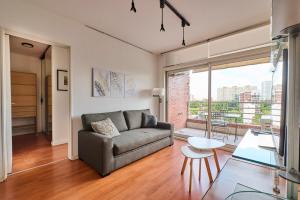 a living room with a couch and a table at Ayres de Nuñez 5 stars in Buenos Aires